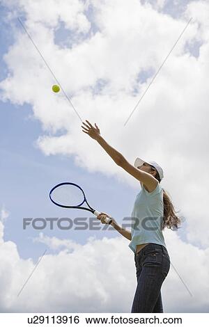 A woman playing tennis View Large Photo Image Stock Photograph - A woman playing tennis. Fotosearch