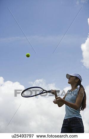 A woman playing with ball View Large Photo Image Stock Photo - A woman playing with ball. Fotosearch
