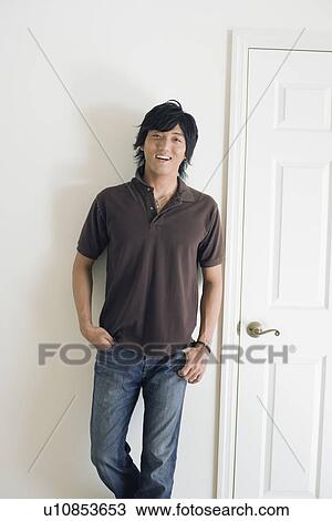Portrait of a young man smiling View Large Photo Image Stock Image - Portrait of a young man smiling. Fotosearch