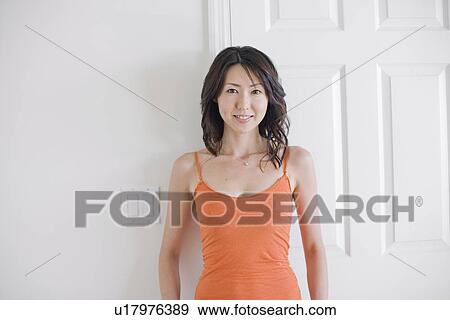 Portrait of young woman smiling View Large Photo Image Stock Photo - Portrait of young woman smiling. Fotosearch