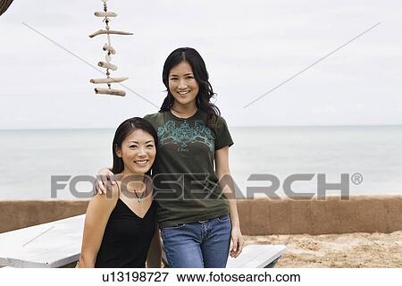 Portrait of young women smiling View Large Photo Image Stock Photo - Portrait of young women smiling. Fotosearch