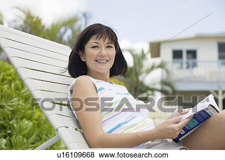 Mid adult woman smiling View Large Photo Image Stock Photo - Mid adult woman smiling. Fotosearch