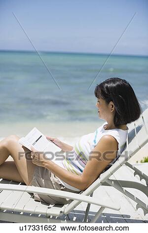 Profile of a woman reading book View Large Photo Image Stock Image - Profile of a woman reading book. Fotosearch