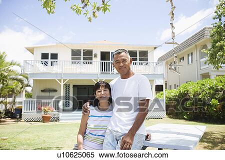 View of a couple smiling at garden View Large Photo Image Stock Photography - View of a couple smiling at garden. Fotosearch