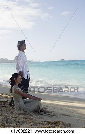 A young couple on beach View Large Photo Image Stock Image - A young couple on beach. Fotosearch