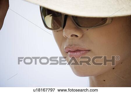 Close-up of a young woman View Large Photo Image Stock Photo - Close-up of a young woman. Fotosearch