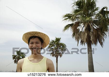 Stock Photograph - Portrait of a young man smiling. Fotosearch