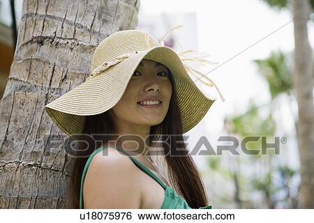 Portrait of a young woman smiling View Large Photo Image Stock Photograph - Portrait of a young woman smiling. Fotosearch