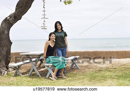 View of young women together smiling View Large Photo Image Stock Photo - View of young women together smiling. Fotosearch