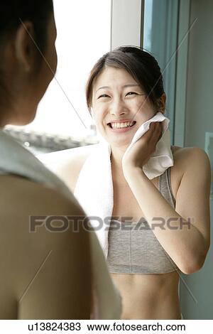 Two young women share a laughter moment after their exercise View Large Photo Image Stock Image - Two young women share a laughter moment after their exercise. Fotosearch