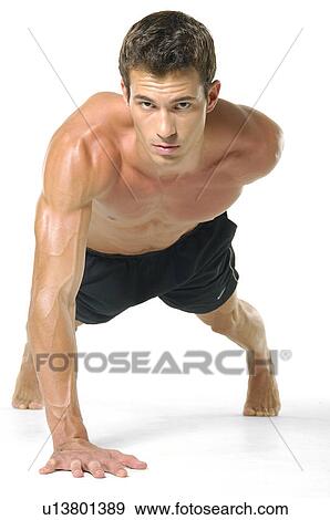 Portrait of a young man doing one hand push-ups View Large Photo Image Stock Photo - Portrait of a young man doing one hand push-ups. Fotosearch