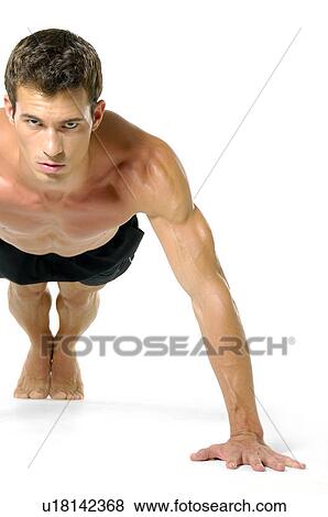 Portrait of a young man doing push-ups View Large Photo Image Stock Photo - Portrait of a young man doing push-ups. Fotosearch