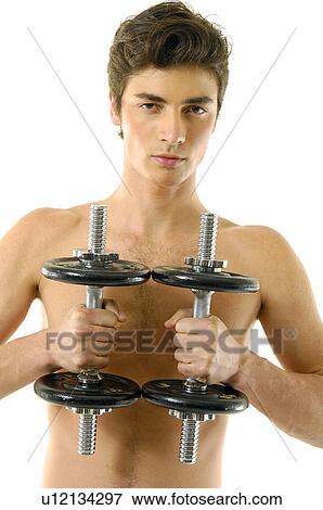 Portrait of a young man exercising with hand weights View Large Photo Image Stock Photo - Portrait of a young man exercising with hand weights. Fotosearch