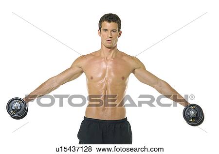 Stock Photo - Portrait of a young man exercising with hand weights. Fotosearch