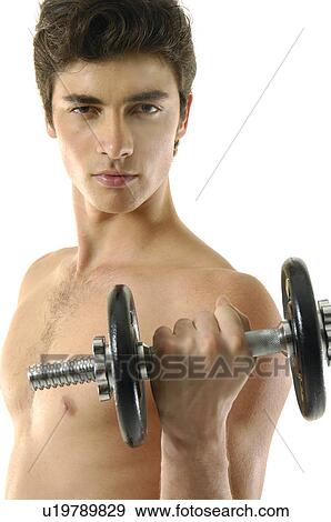 Stock Photo - Portrait of a young man exercising with a hand weight. Fotosearch