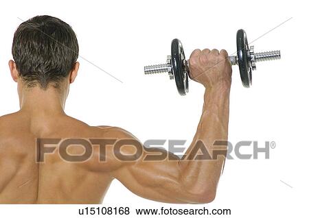 Stock Photo - Rear view of a man exercising with a hand weight. Fotosearch