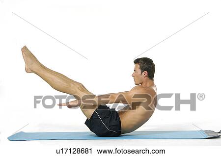 Stock Image - Side profile of a young man doing sit-ups. Fotosearch