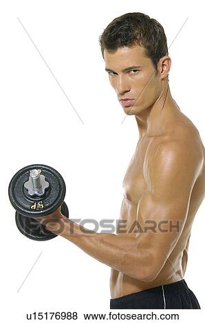 Side profile of a young man exercising with a hand weight View Large Photo Image Stock Photo - Side profile of a young man exercising with a hand weight. Fotosearch