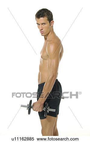 Side profile of a young man exercising with a hand weight View Large Photo Image Stock Photography - Side profile of a young man exercising with a hand weight. Fotosearch