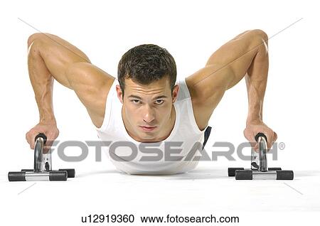 Stock Image - Portrait of a young man exercising. Fotosearch