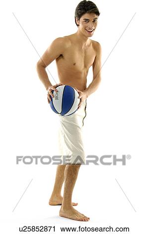 Portrait of a young man playing basketball View Large Photo Image Stock Image - Portrait of a young man playing basketball. Fotosearch