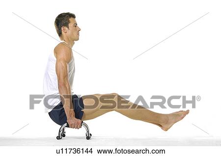 Side profile of a young man exercising View Large Photo Image Picture - Side profile of a young man exercising. Fotosearch