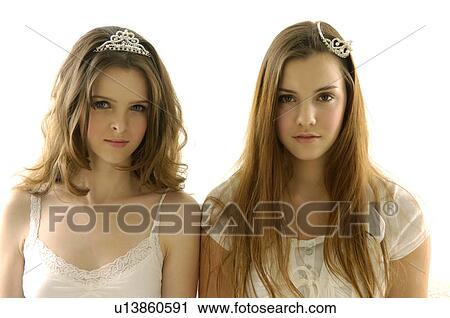 Portrait of two young women wearing tiaras View Large Photo Image Stock Image - Portrait of two young women wearing tiaras. Fotosearch