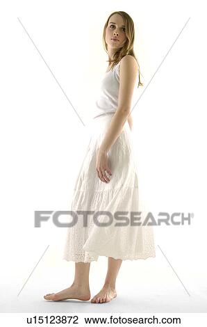 Stock Image - Side profile of a young woman posing. Fotosearch