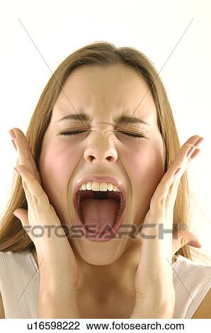 Close-up of a young woman screaming View Large Photo Image Stock Image - Close-up of a young woman screaming. Fotosearch