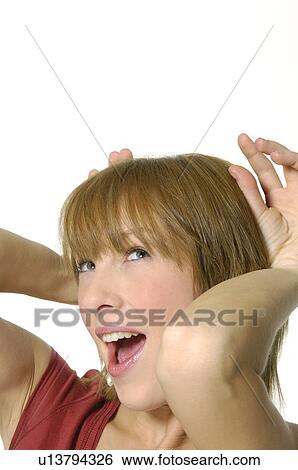 Close-up of a young woman shouting View Large Photo Image Stock Photograph - Close-up of a young woman shouting. Fotosearch