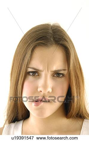 Portrait of a young woman biting her lips View Large Photo Image Stock Photo - Portrait of a young woman biting her lips. Fotosearch