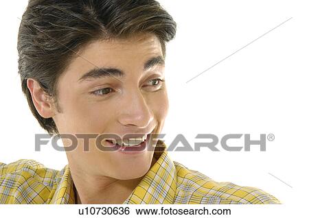 Stock Photograph - Close-up of a young man smiling. Fotosearch