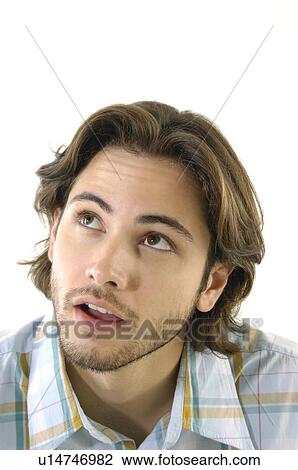 Close-up of a young man thinking View Large Photo Image Stock Image - Close-up of a young man thinking. Fotosearch