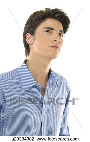 Close-up of a young man thinking View Large Photo Image Stock Image - Close-up of a young man thinking. Fotosearch