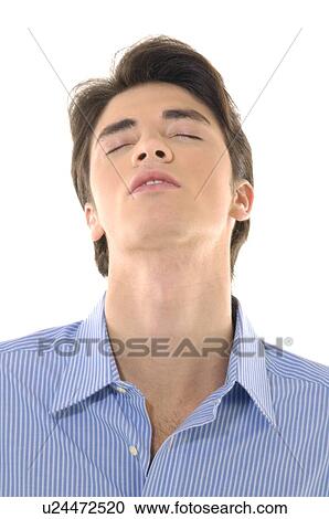 Close-up of a young man thinking with his eyes closed View Large Photo Image Stock Image - Close-up of a young man thinking with his eyes closed. Fotosearch
