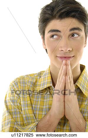 Close-up of a young man with his folded hands View Large Photo Image Stock Photography - Close-up of a young man with his folded hands. Fotosearch