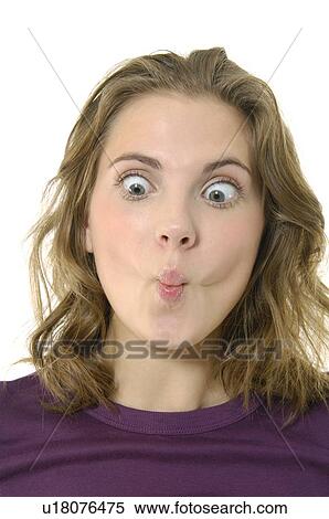 Close-up of a young woman puckering her lips View Large Photo Image Stock Photography - Close-up of a young woman puckering her lips. Fotosearch