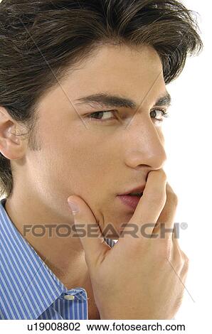 Portrait of a young man thinking View Large Photo Image Stock Image - Portrait of a young man thinking. Fotosearch