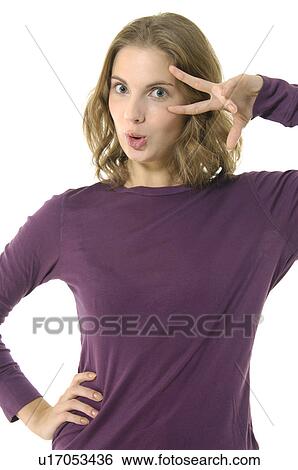 Portrait of a young woman gesturing View Large Photo Image Stock Photograph - Portrait of a young woman gesturing. Fotosearch