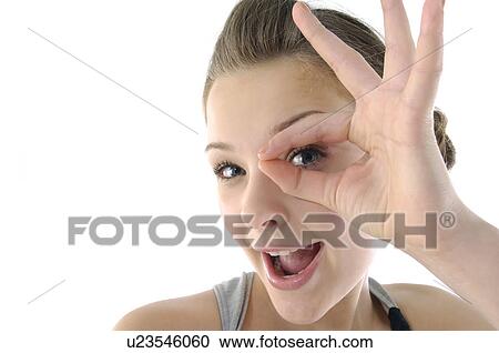 Portrait of a young woman pretending to wear glasses View Large Photo Image Stock Image - Portrait of a young woman pretending to wear glasses. Fotosearch