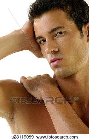 Portrait of a young man flexing his muscles View Large Photo Image Stock Photo - Portrait of a young man flexing his muscles. Fotosearch