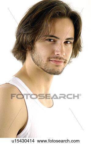 Portrait of a young man smiling View Large Photo Image Picture - Portrait of a young man smiling. Fotosearch