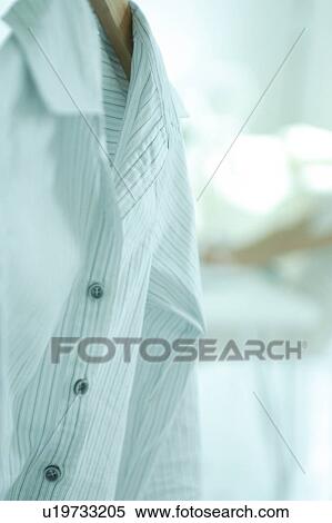 Stock Photography - A blouse hanging . Fotosearch