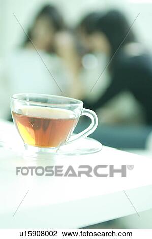 A cup of tea with young women in the background View Large Photo Image Stock Image - A cup of tea with young women in the background. Fotosearch