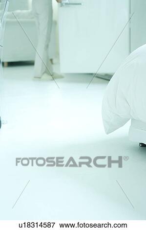 Stock Photo - A woman in living room. Fotosearch