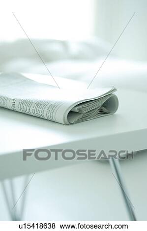 Newspaper on table View Large Photo Image Stock Photo - Newspaper on table. Fotosearch