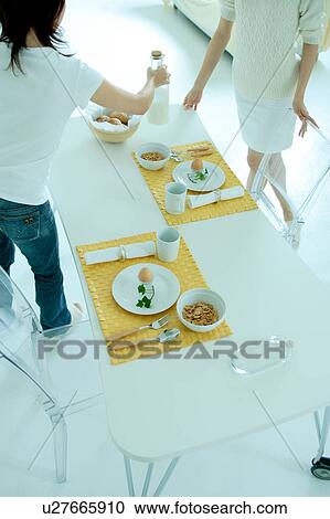 Two women in dining room View Large Photo Image Stock Image - Two women in dining room. Fotosearch