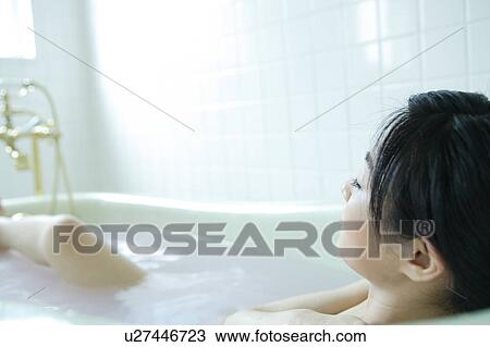 A young woman in bathtub View Large Photo Image Stock Image - A young woman in bathtub. Fotosearch