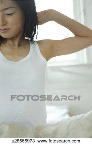 A young woman waking up and stretching View Large Photo Image Stock Image - A young woman waking up and stretching. Fotosearch