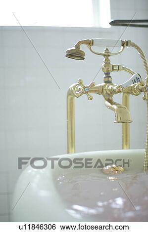 Stock Photograph - Bathtub and faucet. Fotosearch